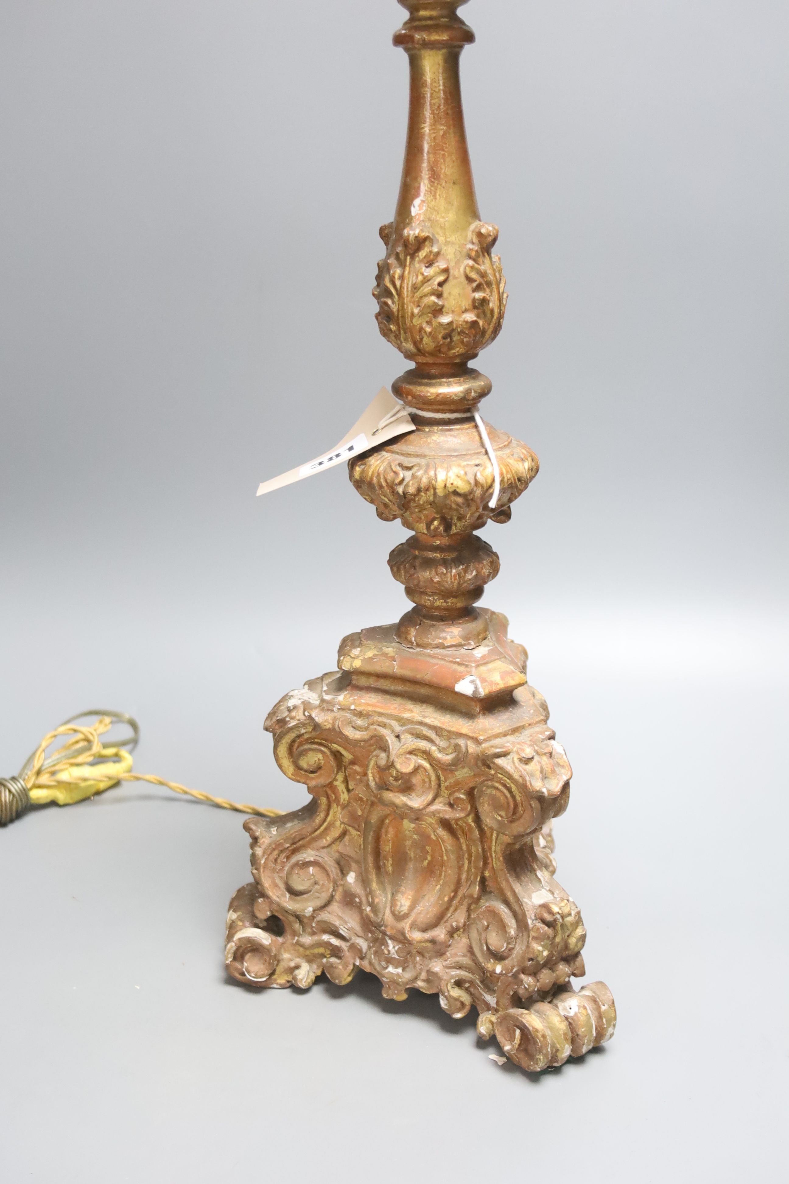 A late 19th century Italian Baroque style giltwood and gesso candlestand